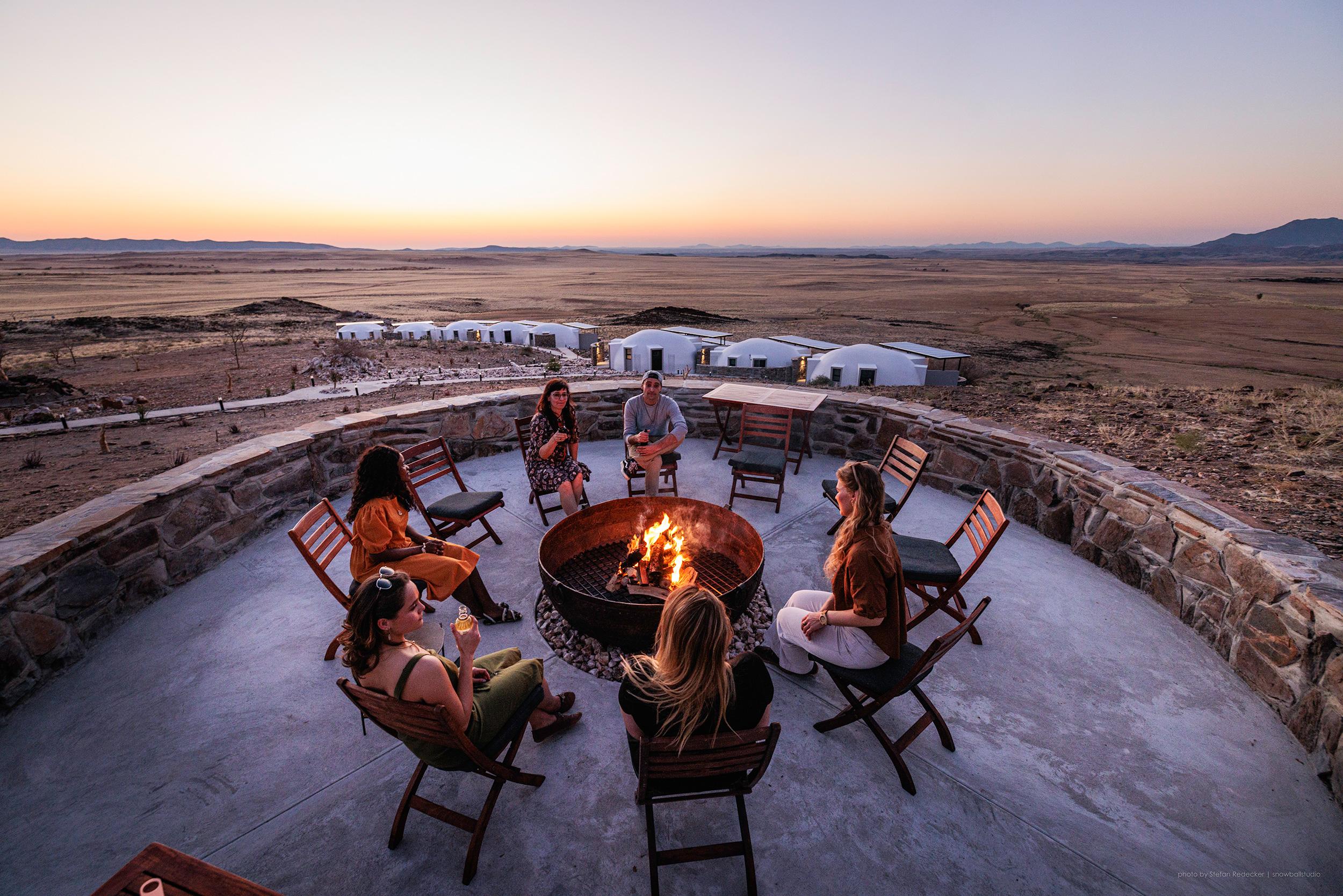 Outdoor boma fire pit under a brilliant starry night sky in the Namib Desert