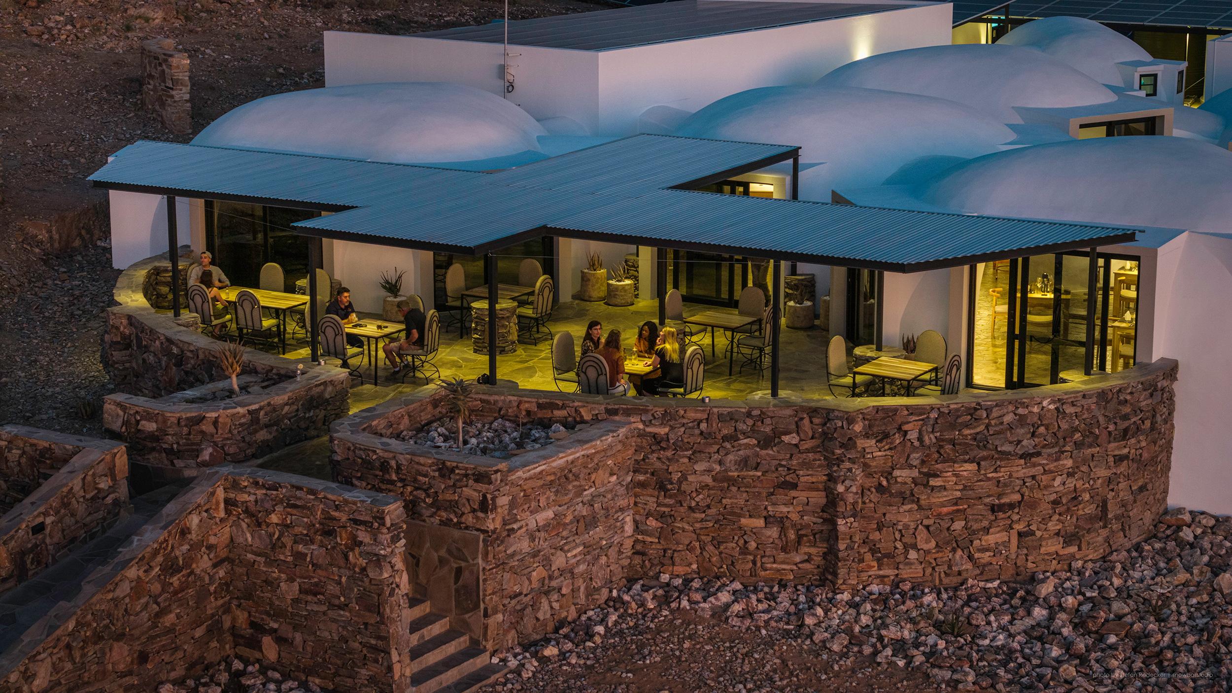 Panoramic view of the ancient red gneiss Rotstock mountains bordering Rostock Ritz Desert Lodge in Namibia